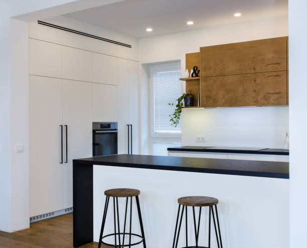 istock Modern kitchen design in light interior with wood accents. 819139444