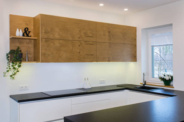 istock Modern kitchen design in light interior with wood accents. 819139616