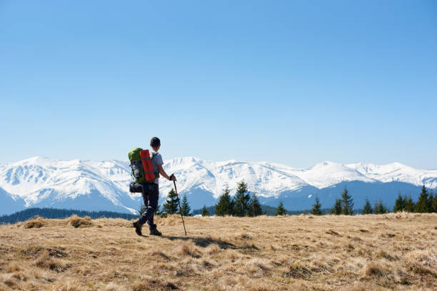 istock Male hiker with backpack in the mountains 819170722