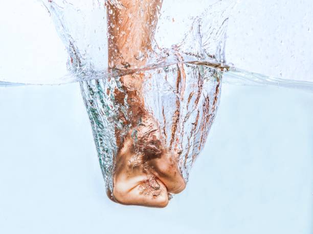 Fist punching water splash