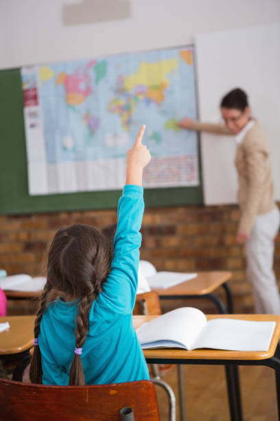istock Pupils listening to their teacher at map 819183882