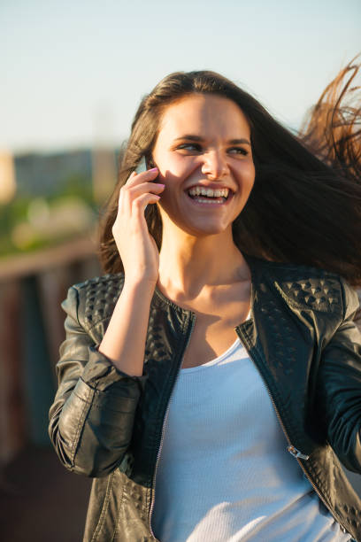istock Smiling girl with phone 819201500