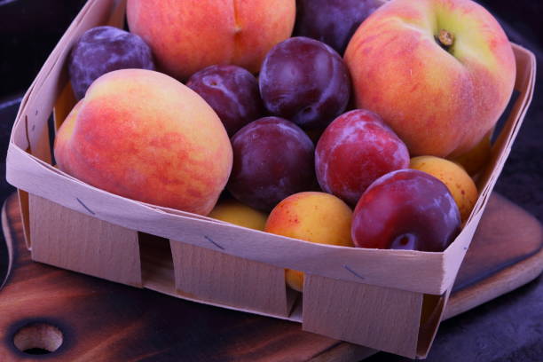 istock Peaches, apricots and plums in the basket 819202768