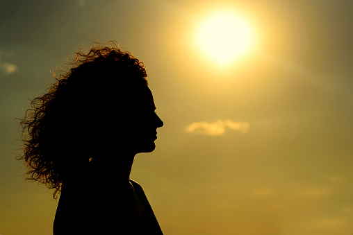 Woman watching the sunrise