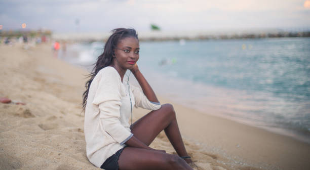 istock Woman relaxing on the sand 819269404
