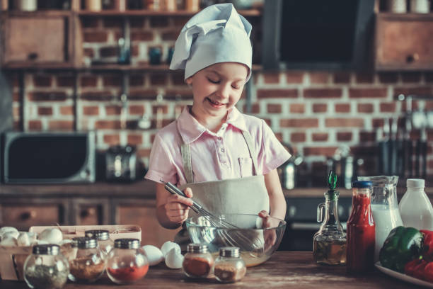 istock Little girl in kitchen 819290150