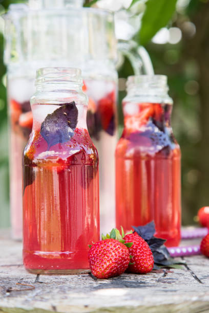 istock Lemonade detox strawberry basil. refreshing drink with fresh strawberry and basil on the background of the garden 819290798