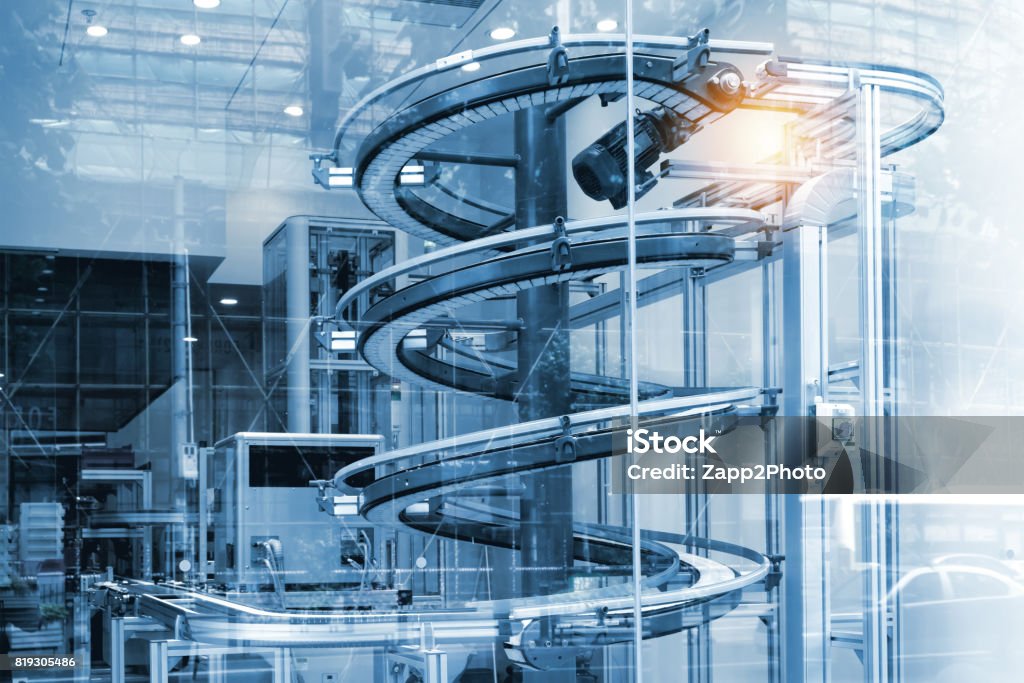 Automated conveyor systems , modular conveyors and industrial automation for package transfer machine in building glass. Blue tone and flare light effect. Manufacturing Stock Photo