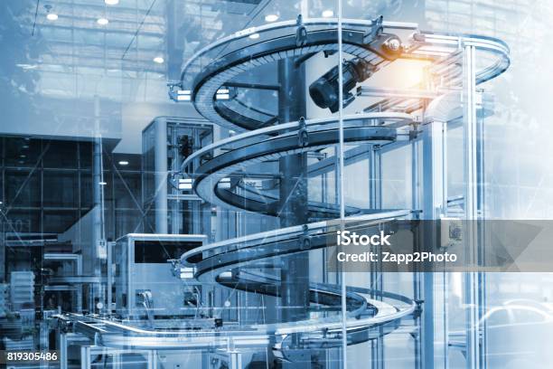 Automated Conveyor Systems Modular Conveyors And Industrial Automation For Package Transfer Machine In Building Glass Blue Tone And Flare Light Effect Stock Photo - Download Image Now