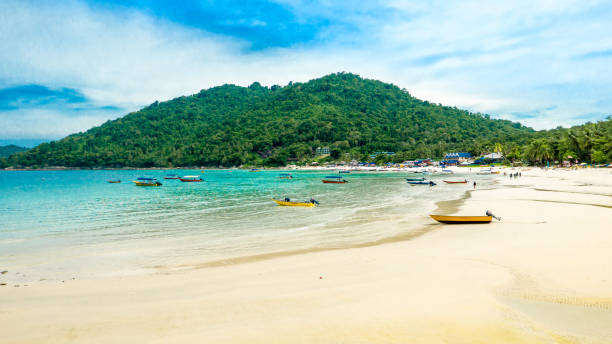 istock Tropical beach with boats 819327814