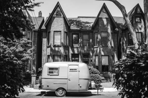 Vintage Camper trailer parked on the urban street of North American City.