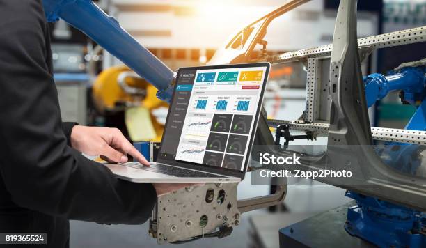 Male Manager Hand Laptop For Check Real Time Production Monitoring System Application In Smart Factory Industrial Automated Conveyor Systems For Package Transfer Machine Industry 40 And Iot Concept Stock Photo - Download Image Now