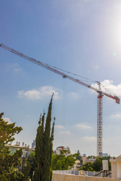 istock Construction crane in a neighborhood vertical 819378126