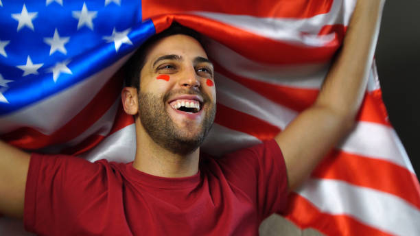 istock American Guy Waving USA Flag 819381544