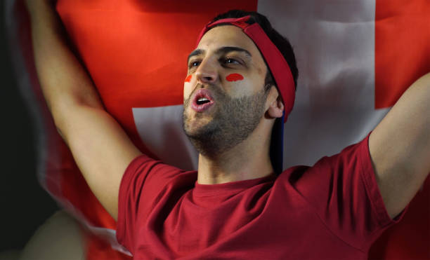 istock Swiss Guy Waving Switzerland Flag 819381548