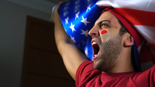 istock American Guy Waving USA Flag 819381550