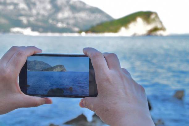 istock Shot of the seascape with an Android phone 819381702