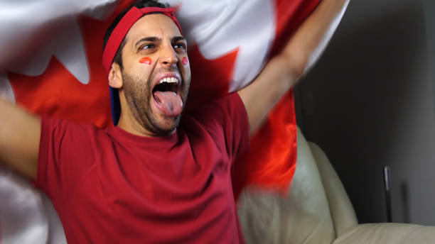 istock Canadian Guy Waving Canada Flag 819381722