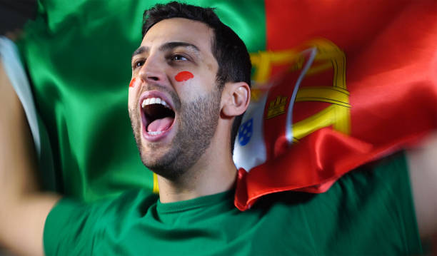istock Portuguese Guy Waving Portugal Flag 819381768
