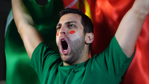 istock Portuguese Guy Waving Portugal Flag 819381874