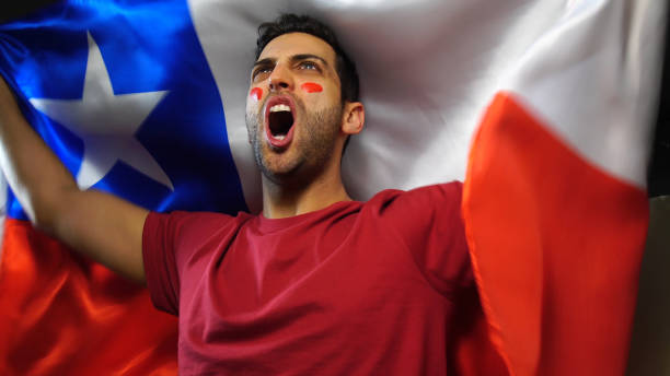 istock Chilean Guy Celebrating with Chile Flag 819382134