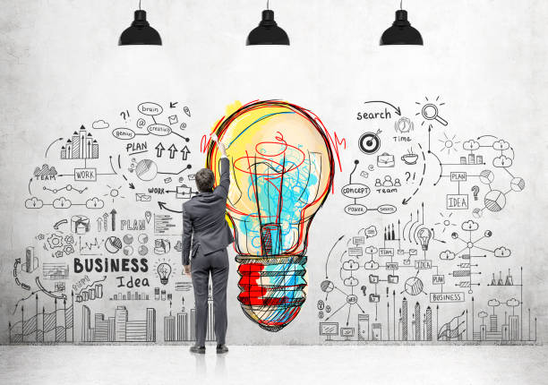 istock Businessman with a brush drawing creative idea 819394432