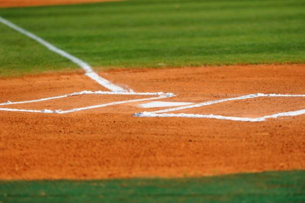 istock Home plate and batters box on baseball field 819399964