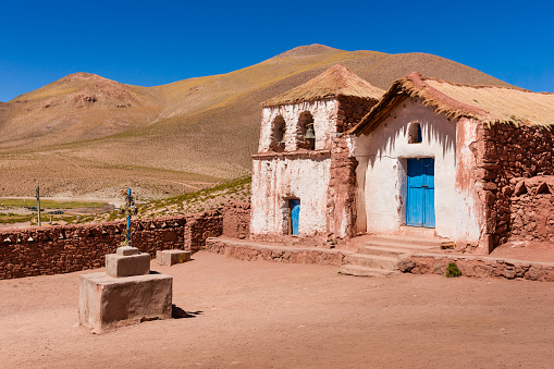 Yard in front of the church in Machuca, which is a small Andean village of 20 houses, located a few kilometers from San Pedro de Atacama. This photograph was taken midday with full frame camera and Zeiss wide angle lens.