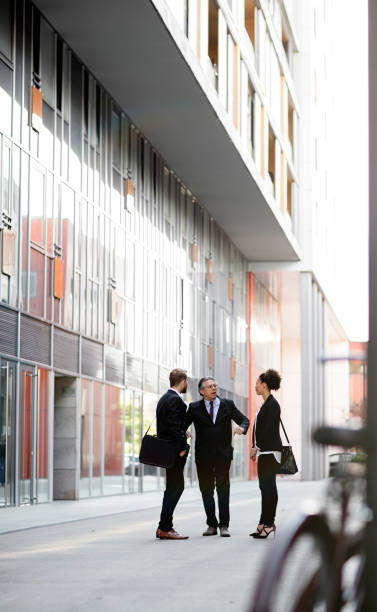 istock Business people walking downtown business district 819410336