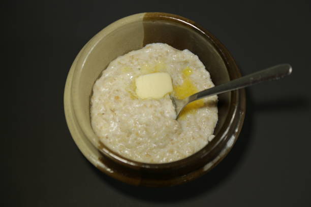 istock Oat porridge milk butter dark background high angle 819410720