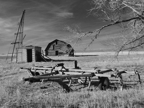 Old broken down abandoned wood building in rural Colorado in western USA of North America. Unusual style with round lookout room on top .