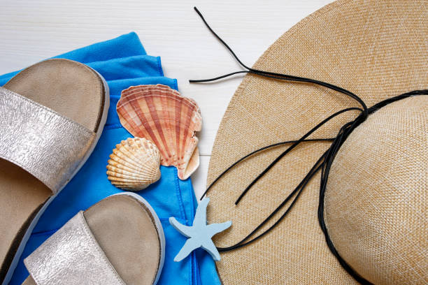 istock summer vacation female accessories on white wooden background 819419656