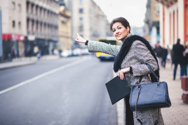 istock Businesswoman waiting for a cab 819419952