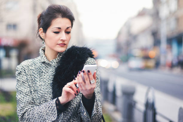 istock Young businesswoman texting 819420086