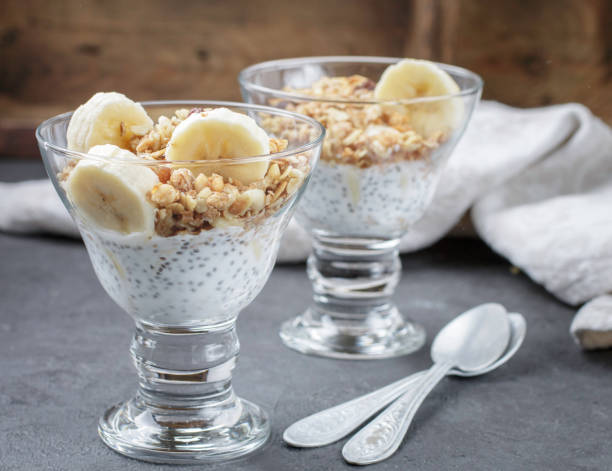 istock Yogurt with Chia seeds, banana, nuts and granola. Healthy Breakfast. Selective focus 819438152