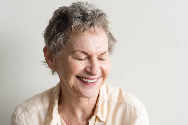istock Older woman laughing 819438322