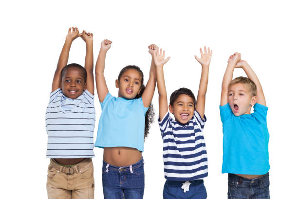 istock Cute children cheering at camera 819446182