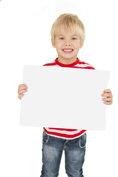 istock Cute little boy showing white page 819456860