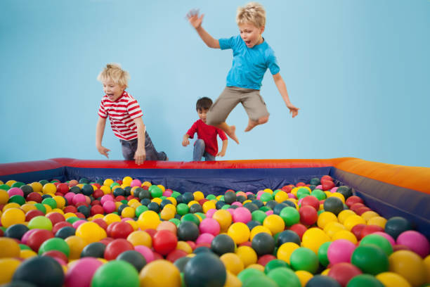 Happy children playing in ball pool