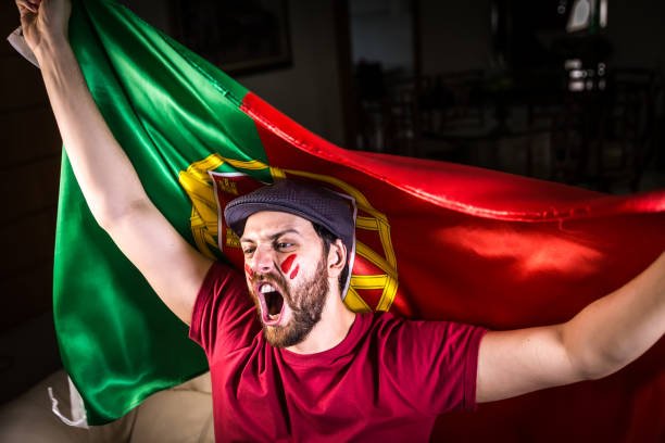 istock Portuguese fan holding the national flag 819459568