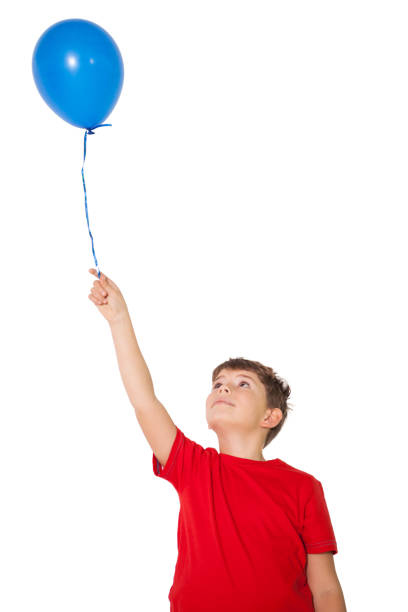 istock Happy little boy holding blue balloon 819462156