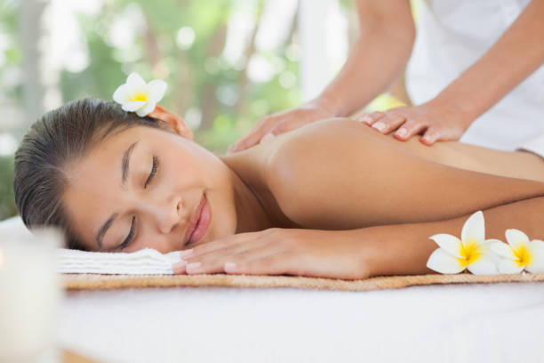 istock Beautiful brunette enjoying a shoulder massage 819474228