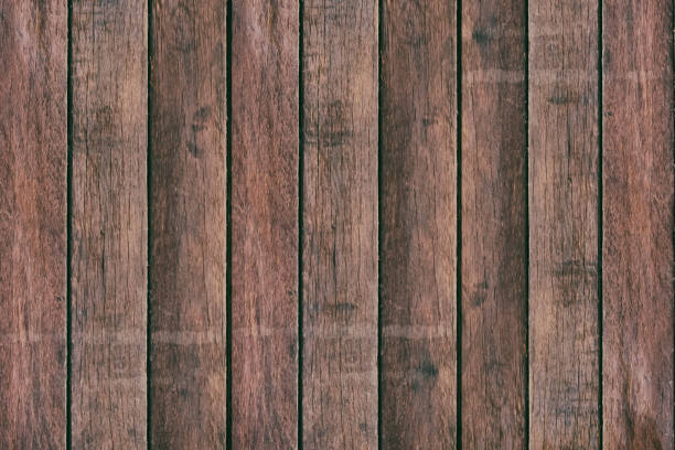 istock Vintage surface wood table and rustic grain texture background. Close up of dark rustic wall made of old wood table planks texture. Rustic brown wood table texture background template for your design. 819474284