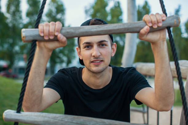 istock Young handsome man portrait outdoors. 819476554