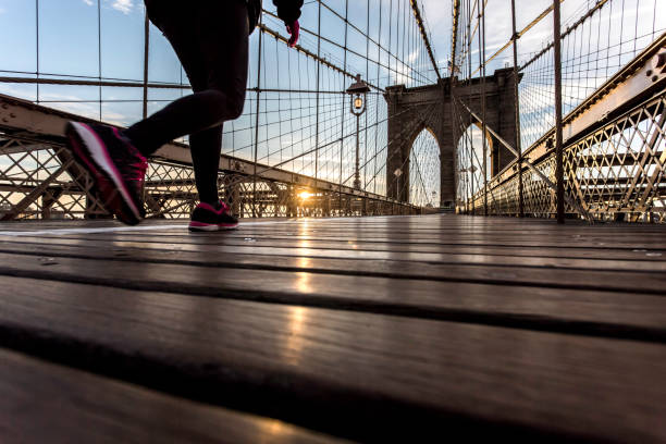 istock Runner on Brooklyn Bridge at Sunrise, New York City 819476718