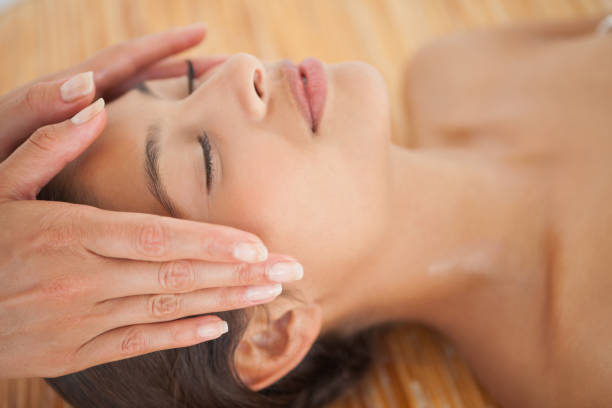 istock Beautiful brunette enjoying a head massage 819488686