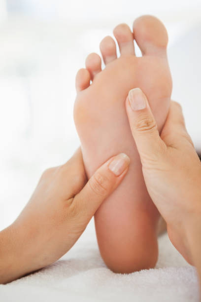 istock Woman receiving a foot massage 819488846