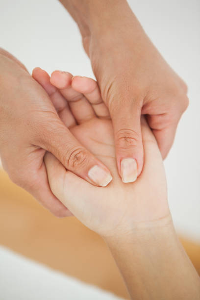istock Woman receiving a hand massage 819488866