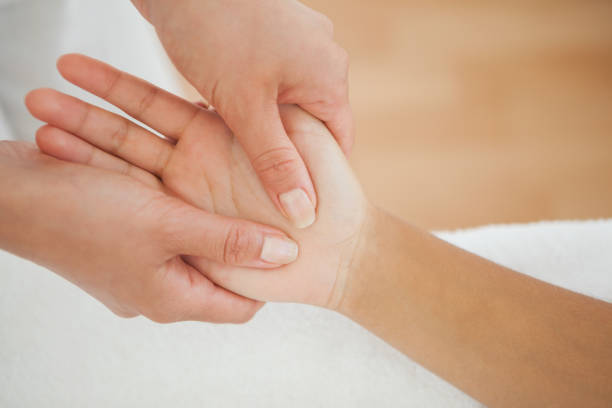 istock Woman receiving a hand massage 819500826
