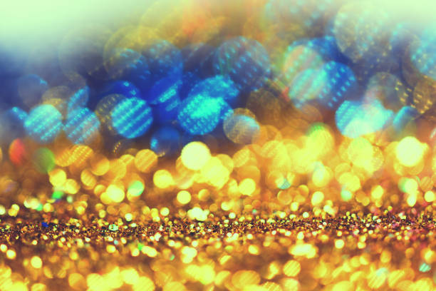 istock Gold glittering christmas lights color full. Blurred abstract background 819504236
